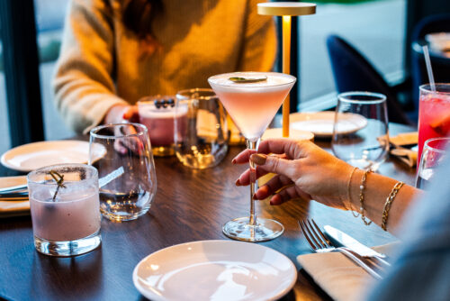 A women holding a glass of drink